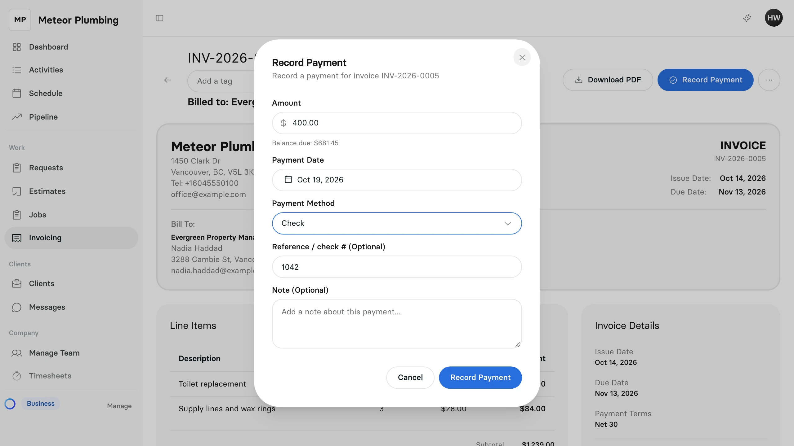 The Record Payment window with an amount entered, Check as the payment method and a check number